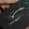 Nash Fluoro D barbless tied hook